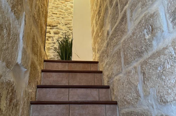 Furnished tourist accommodation in Aimargues, staircase from the first floor to the second.